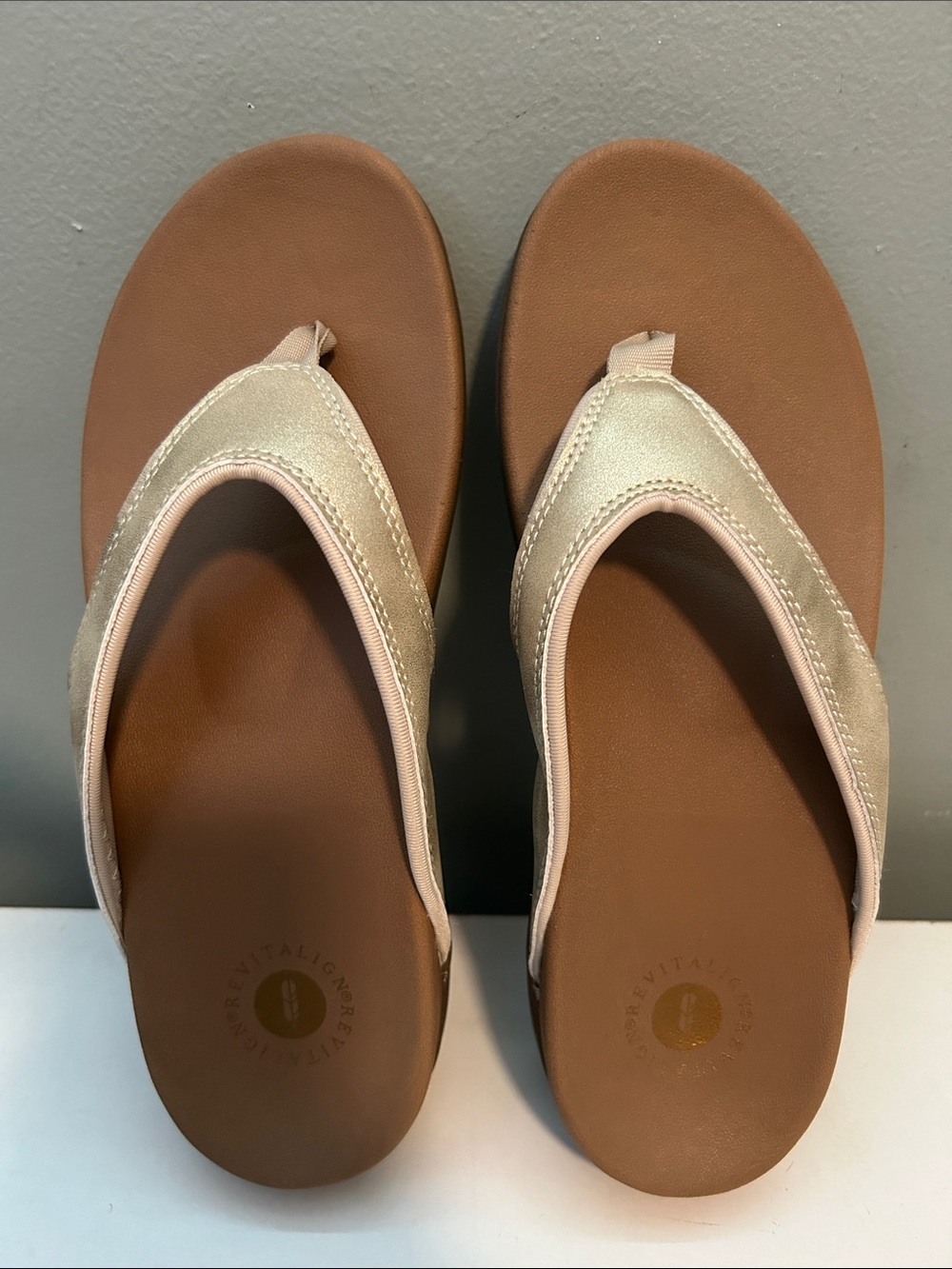 Revitalign shimmer gold flip flops